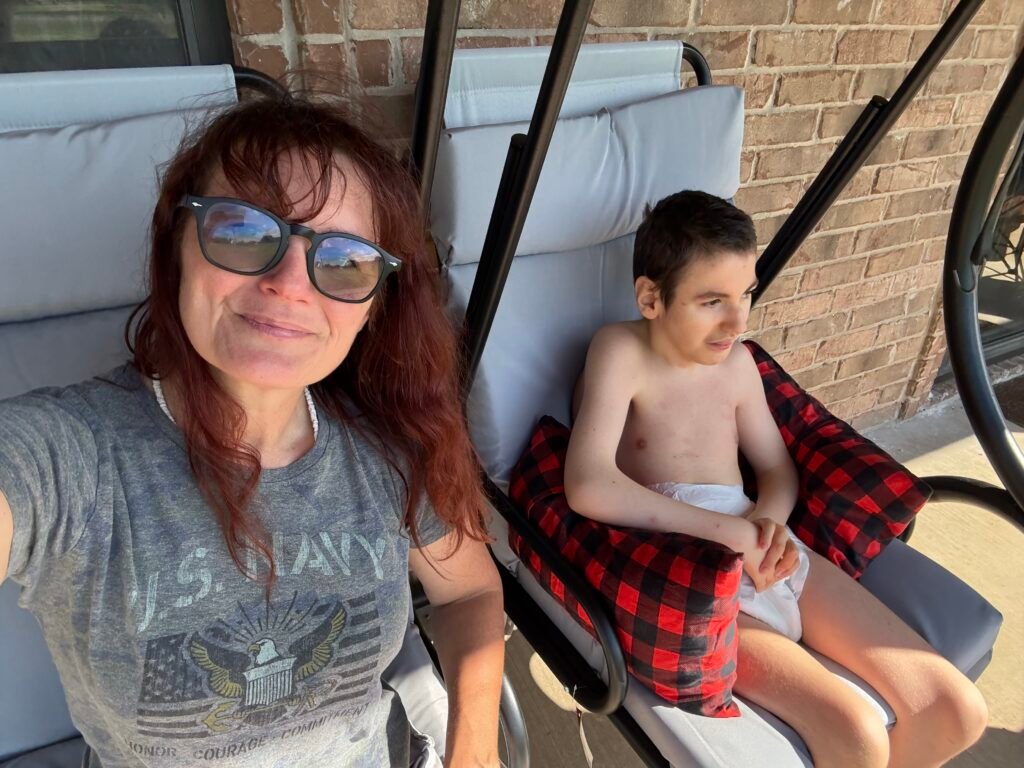 Carla and Charlie in rocking swing