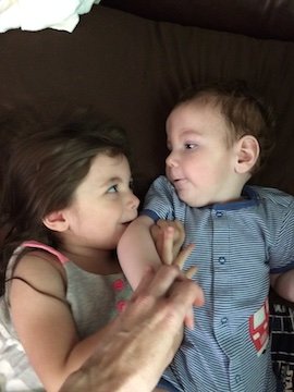 Olivia kissing Charlie's elbow