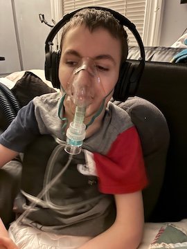 Charlie Karrat doing a nebulizer treatment.