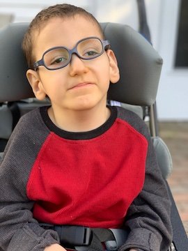Charlie Karrat in his wheelchair. He  has Schaaf-Yang Syndrome.